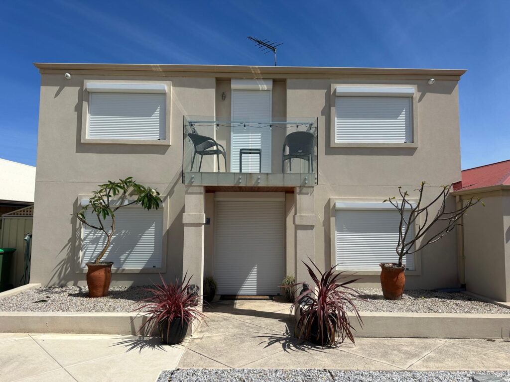Two-storey Perth home with roller shutters-manual vs electric matters for upper floor windows.