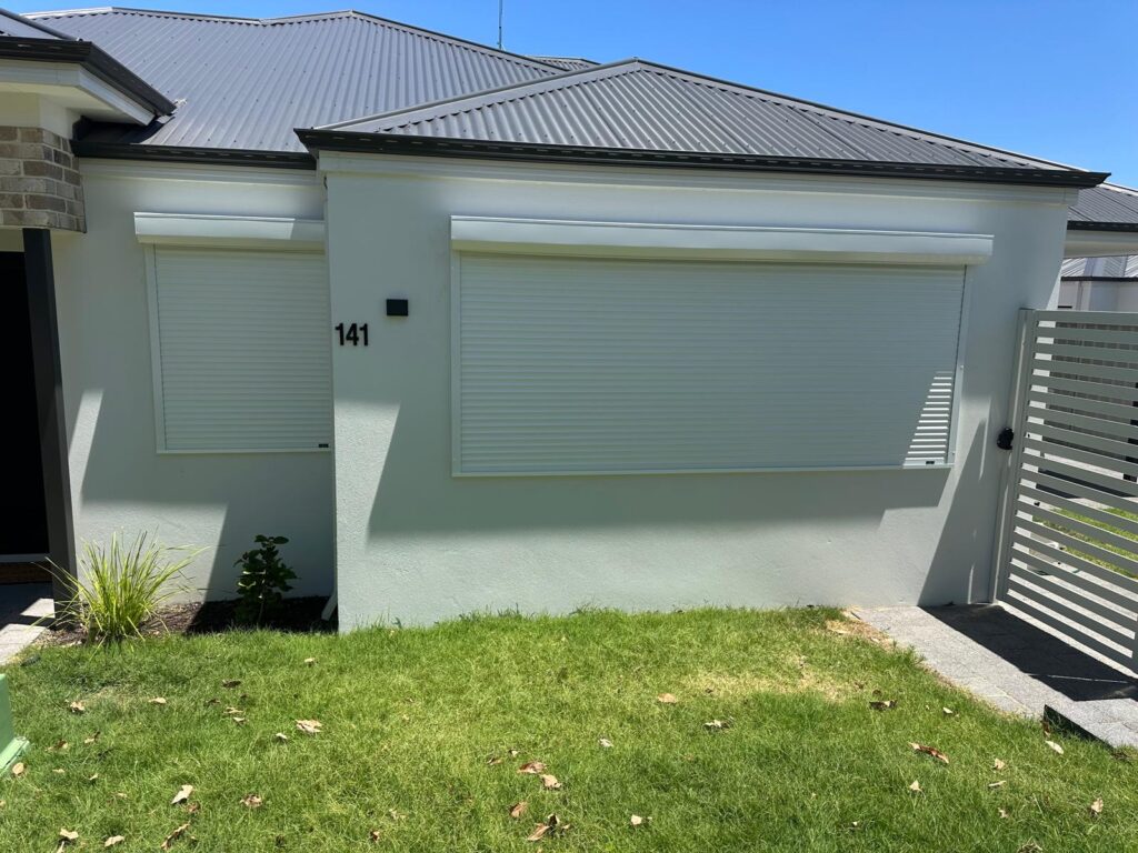 Modern Perth home with white roller shutters - annual servicing keeps them smooth.