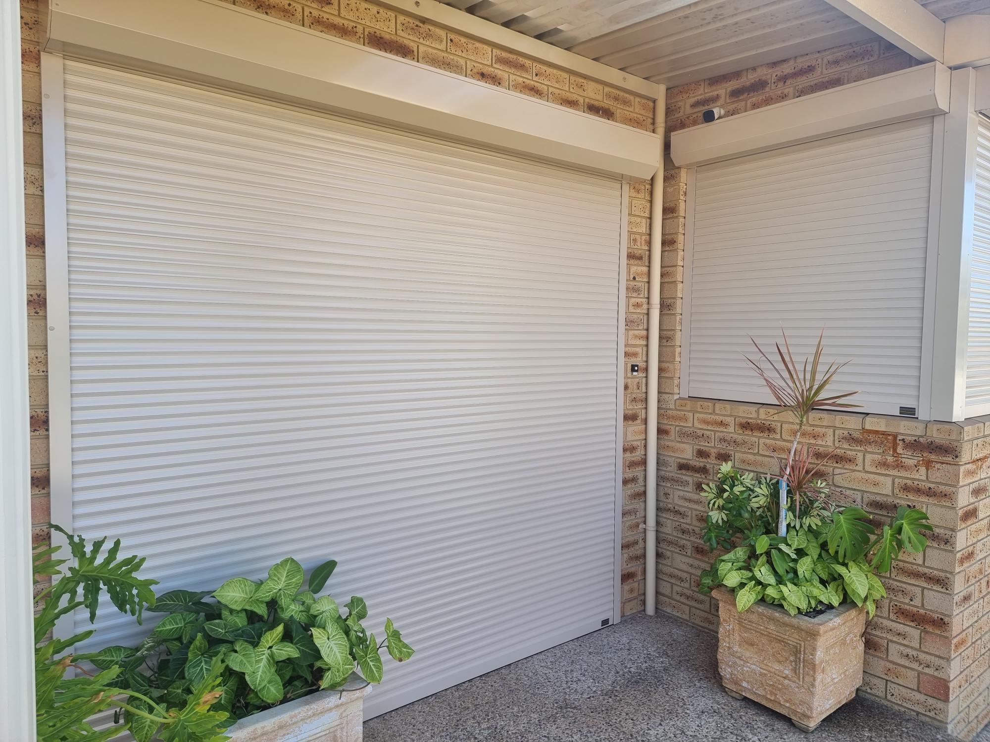 Cream roller shutter, showing the thick aluminium slats that create a dense barrier against outside noise
